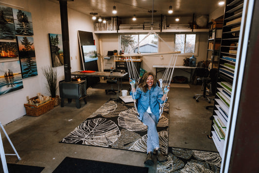 Canadian Artist Melissa Jean in her Northern Ontario art studio, where she creates original paintings inspired by the beauty around her. Located in Keewatin Ontario Canada.